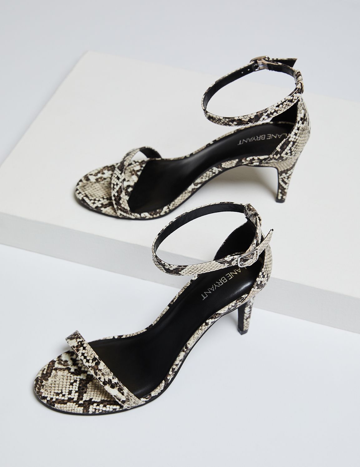 snakeskin strap heels